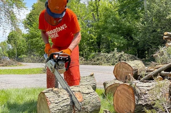 Scott Armstrong, from Hanover, Ont., cleans up a storm damaged property in the Pine Glen area on Monday as part of his volunteer work with disaster relief organization Samaritan's Purse. PHOTO BY ERROL MCGIHON /Postmedia