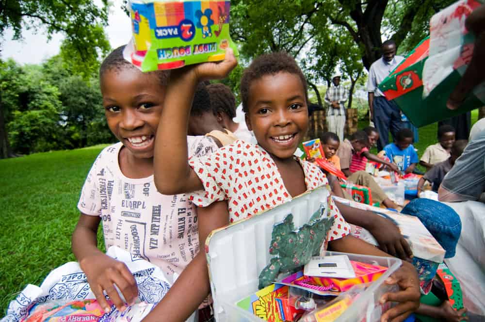 Zimbabwe children receiving their shoebox gifts.