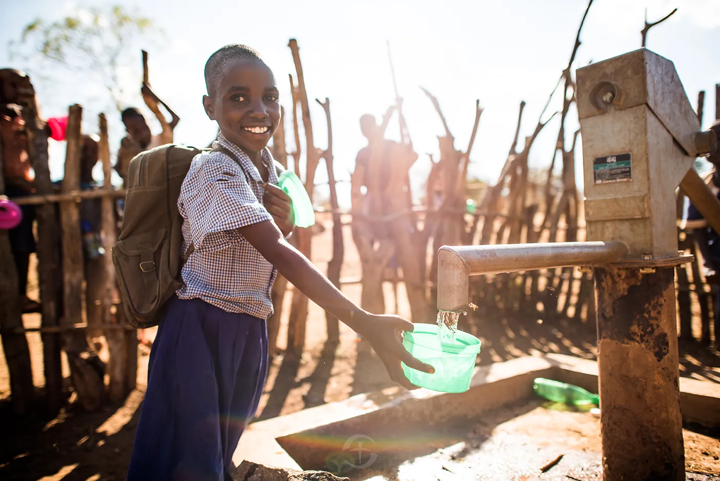 Safe water infrastructure and hygiene training helping a community access clean water.