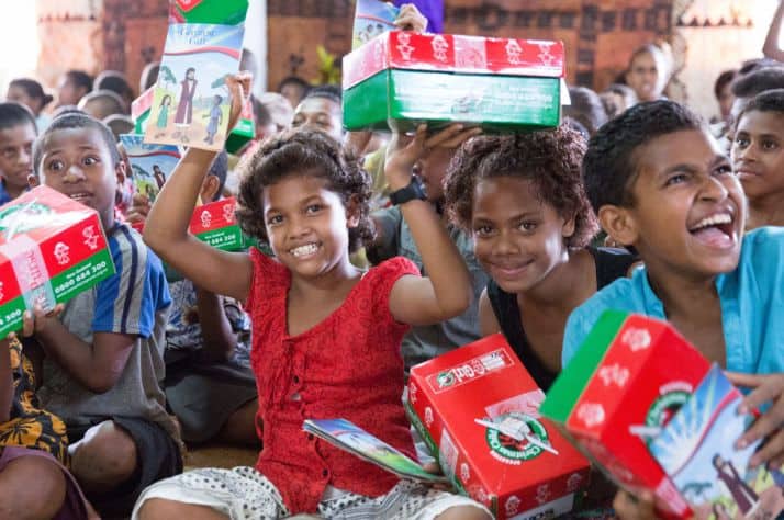 Children are delighted to receive Operation Christmas Child shoebox gifts during a previous distribution in another part of Fiji.