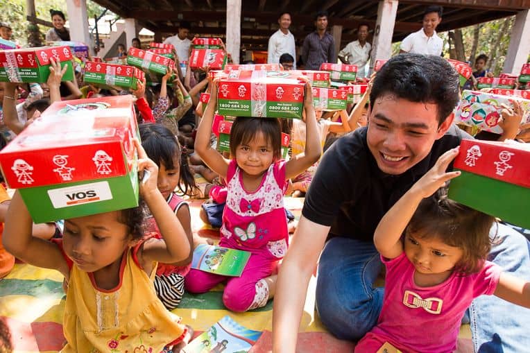 Piseth participates in a shoebox gift distribution.