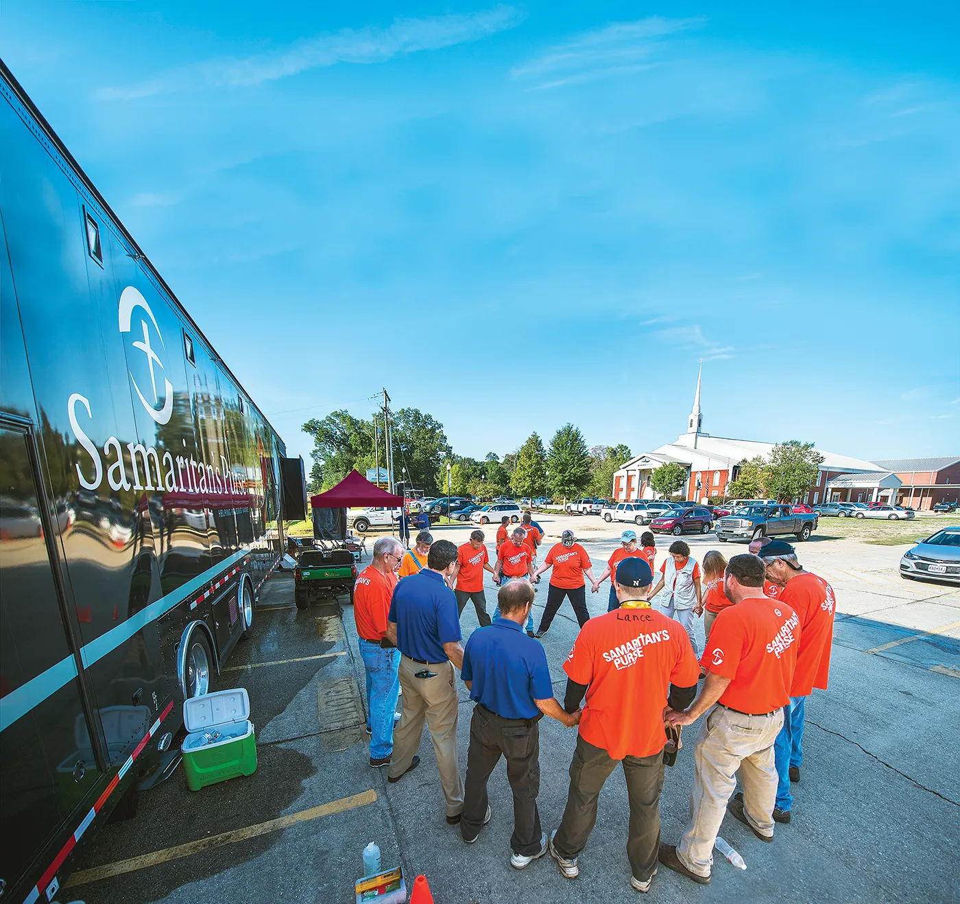 Team of volunteers gathered inside a disaster relief unit