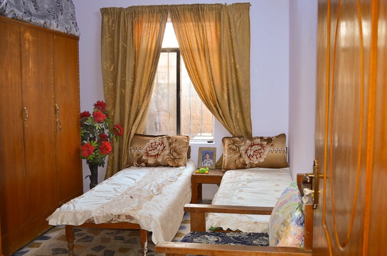 The picture of Miriam’s late husband sits on the nightstand in her daughter’s newly restored room.
