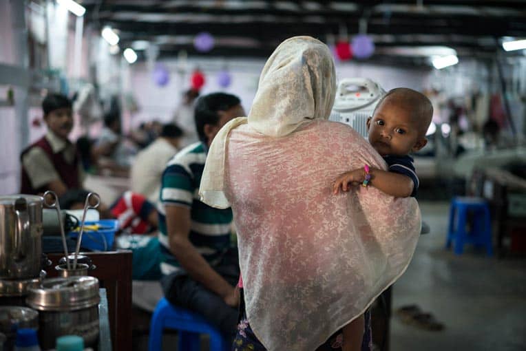 Shanna holds her son Mohammed. He's recovering from a life-threatening infection that started on their jungle journey to Bangladesh.