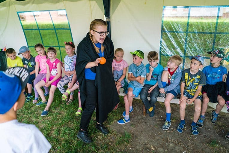 Kristina Hryniuk portrays the temptation of Adam and Eve for her class of 8- and 9-year-olds at The Greatest Journey camp.