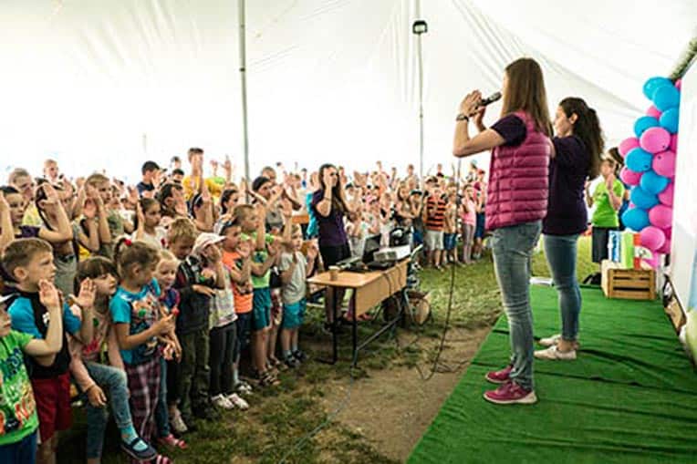 Sophia Bihun (second from right) leads the large group Bible study time at The Greatest Journey camp.