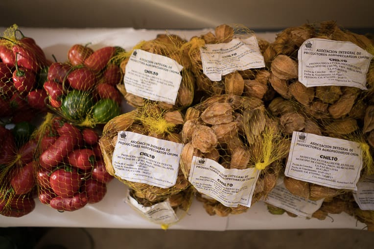 Participants in the farming cooperative we established in Chuma, Bolivia, package locally grown peppers and goldenberries to sell in community markets.
