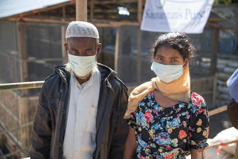Kabir stands with his daughter Shonchita, who was cared for at the Samaritan's Purse Diphtheria Treatment Center.