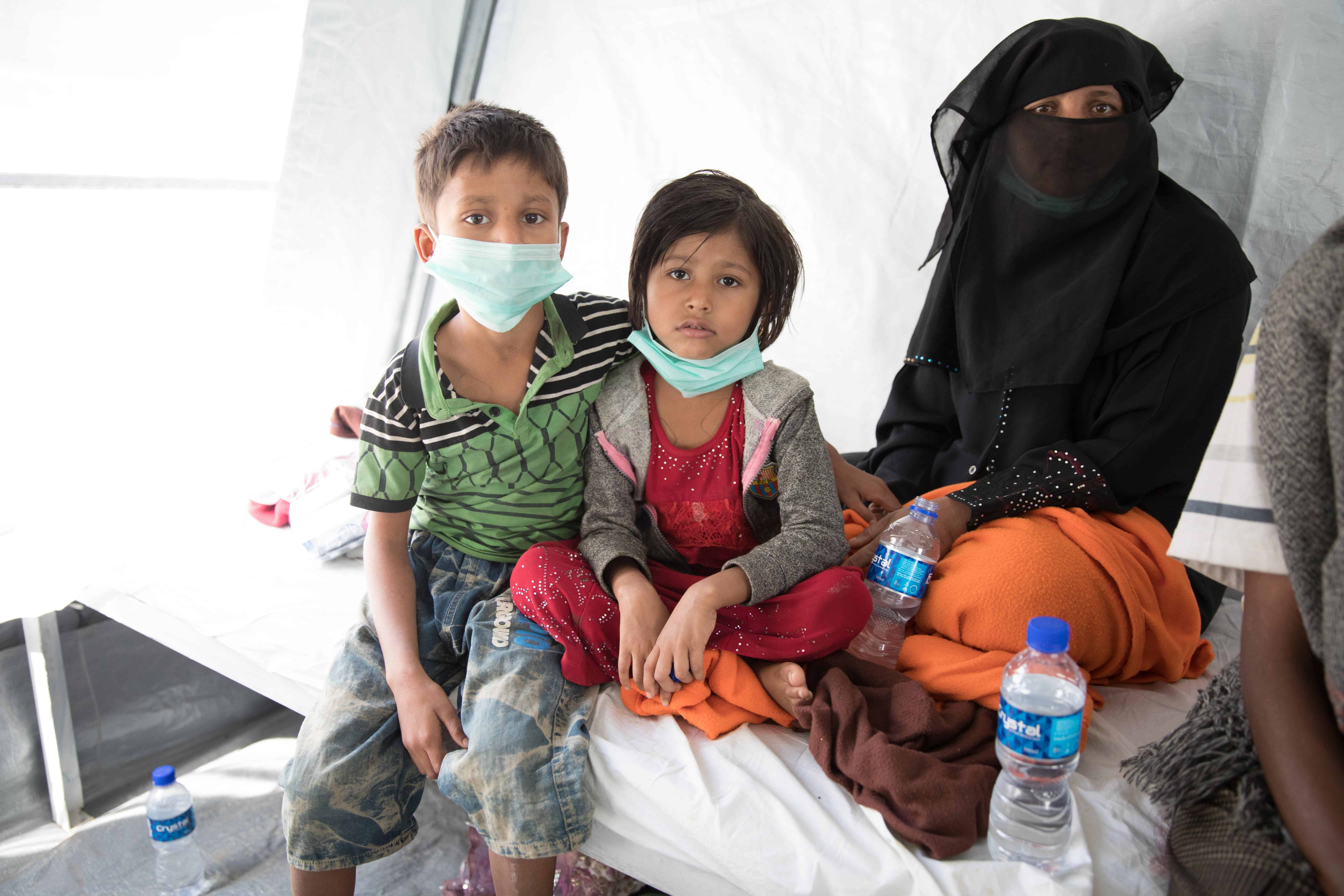 Shamshu (right) with Ziau (left) and Rogina (middle) at the Diphtheria Treatment Center.