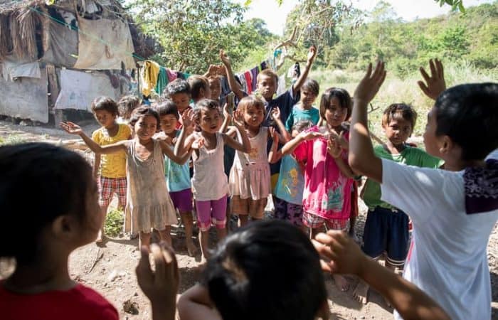 Children in the village sing praises to God.