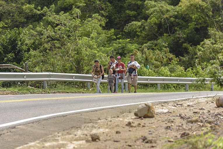 Venezuelan "walkers" are a common sight along the roads near Cucuta.