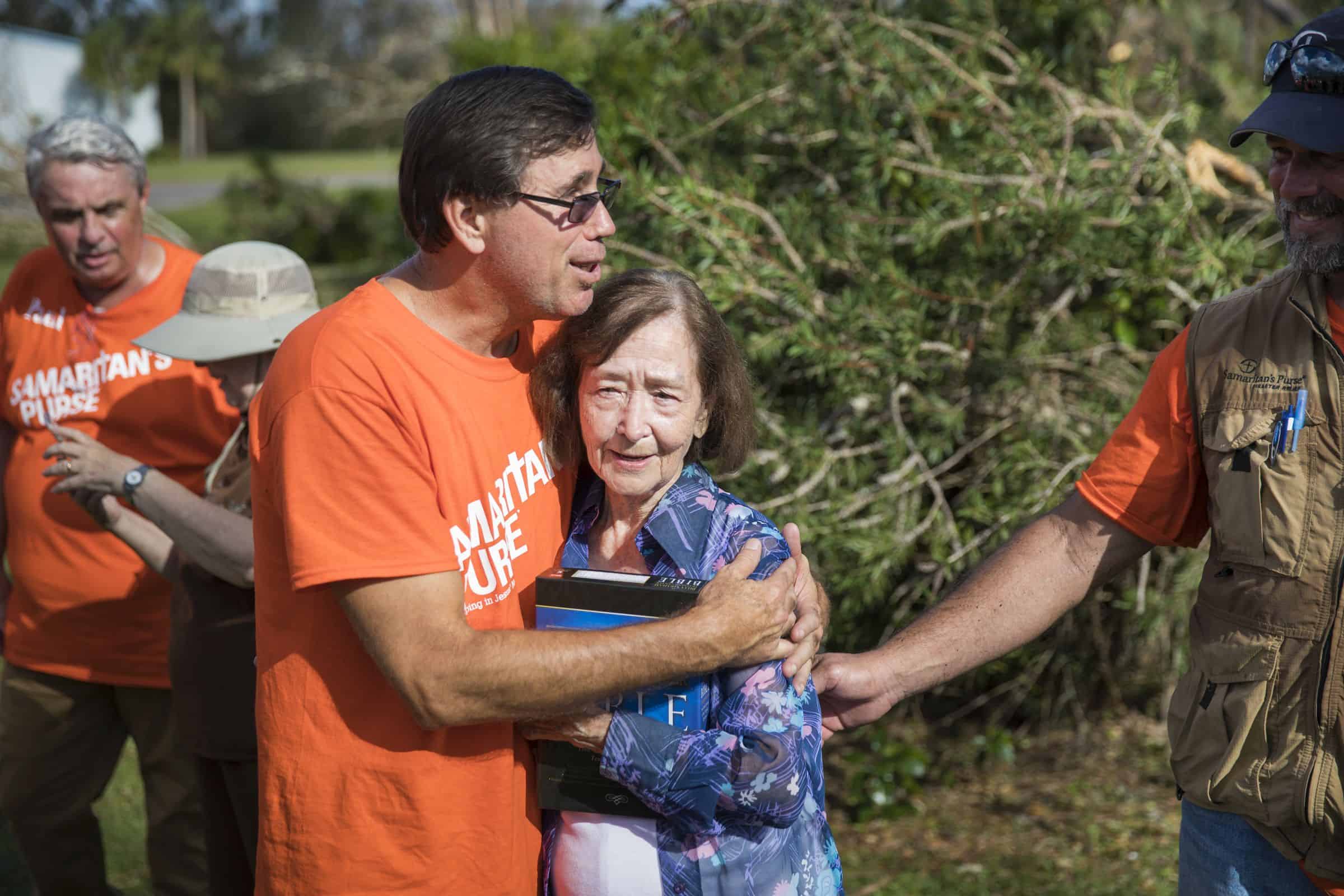 Pastor Mike encourages a homeowner.