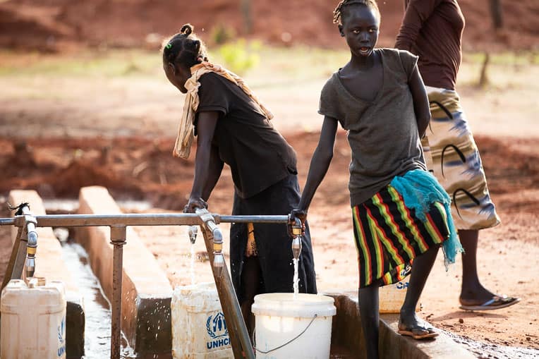 At a point provided by Samaritan’s Purse, people in South Sudan gather water for their daily needs.