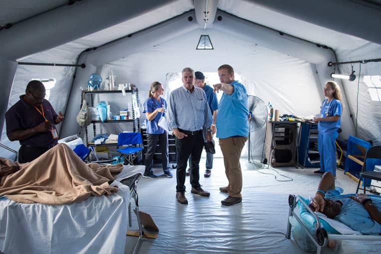 Dr. Elliott Tenpenny, medical director for the Emergency Field Hospital, gave Franklin Graham a tour of the facility on Sept. 16.