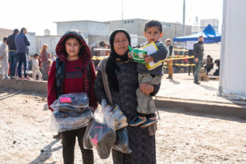 The clothes and shoes provided by Samaritan's Purse will help Rona and her two sons weather the winter months.