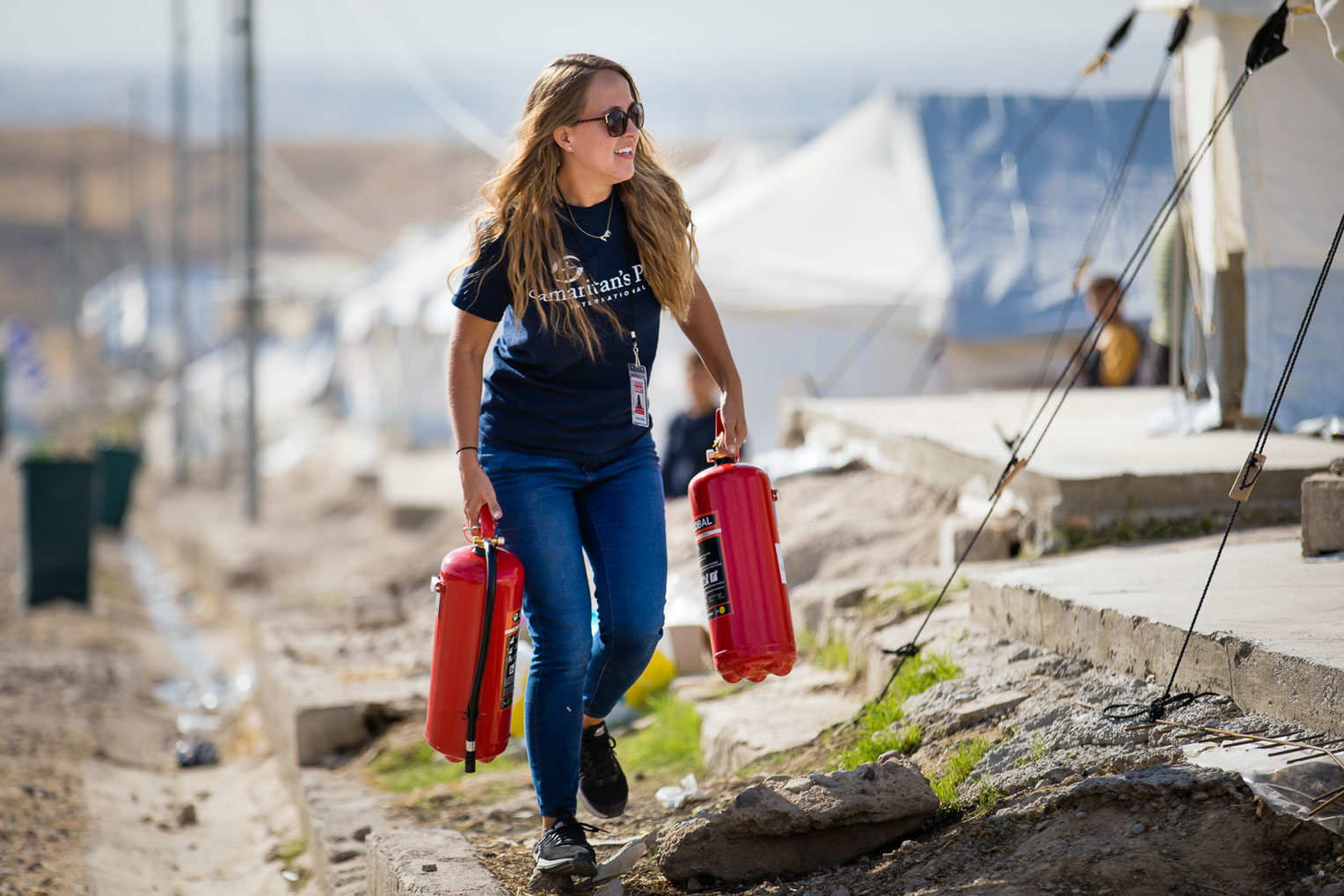 The Samaritan's Purse team distributed fire extinguishers in Bardarash camp to aid refugee families who cook and heat with kerosene.