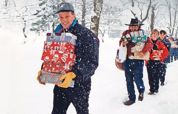 1995 - Franklin Graham, Dennis Agajanian, and others delivered shoebox gifts in Bosnia.