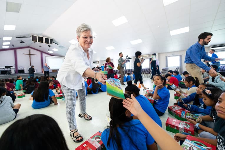 Jane Graham enjoyed visiting with the children of Saipan, the same island where her father fought during World War II when it was occupied by Japan.