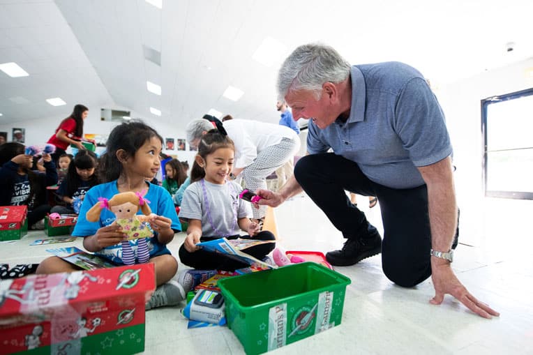 Franklin Graham visited with children in Saipan early in 2020 before Coronavirus was declared a worldwide threat. Graham has a bold vision to deliver gift-filled Operation Christmas Child shoeboxes to the Pacific Islands until every child there is reached.