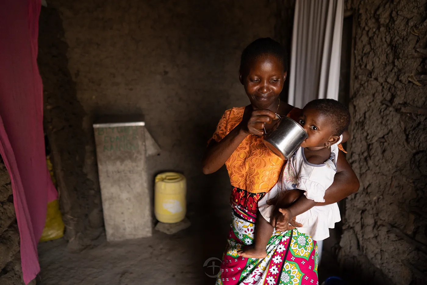Perlah with a household water filter provided through Samaritan’s Purse Water Projects.