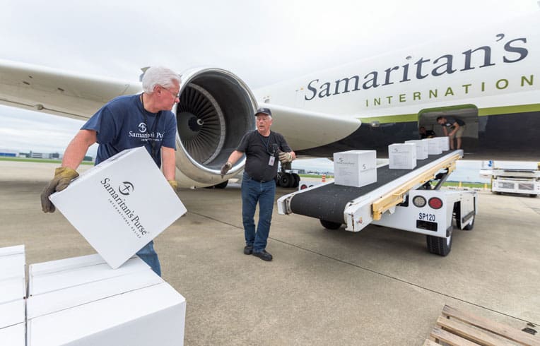 Our team loads supplies onto the DC-8.