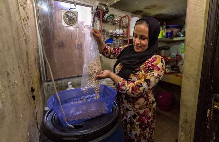 Nazia prepares a meal for her family. Working with church partners, we provided food staples and other necessities for hurting families and residents of Beirut.