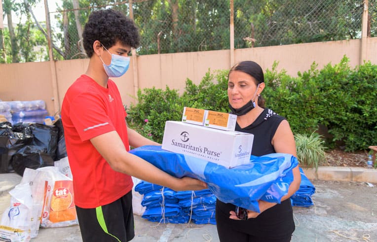 Local volunteers helped our teams distribute hygiene kits, solar lights, and heavy-duty shelter material.