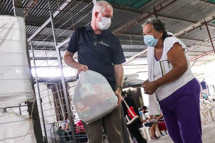 Food and hope: A woman receives life-sustaining emergency food in Colombia.