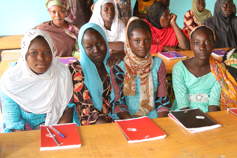 Displaced families learn to read and write, with the hope of reading the Bible in their own language.