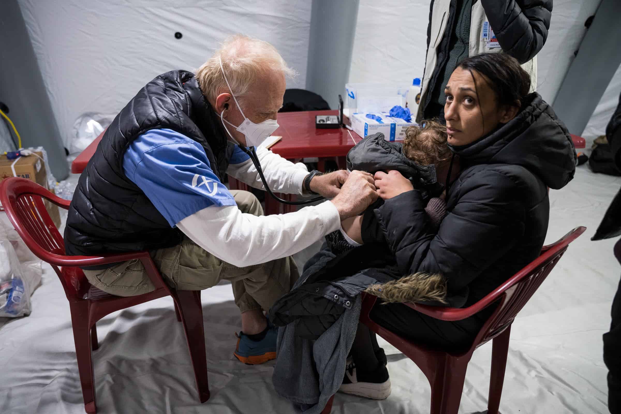 Caring for a sick child at the train station clinic.