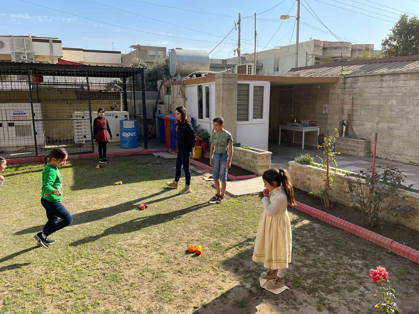 Even games played on the Mosul Family Center lawn help children heal.