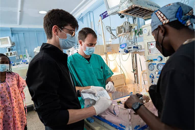 Dr. Fitzwater and colleagues attend to a patient in the Newborn Intensive Care Unit (NICU).