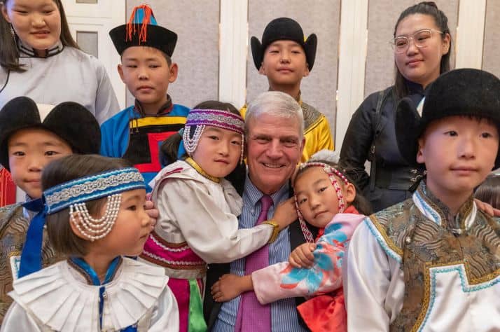 Franklin Graham is all smiles with children who received cardiac surgery through Children's Heart Project.