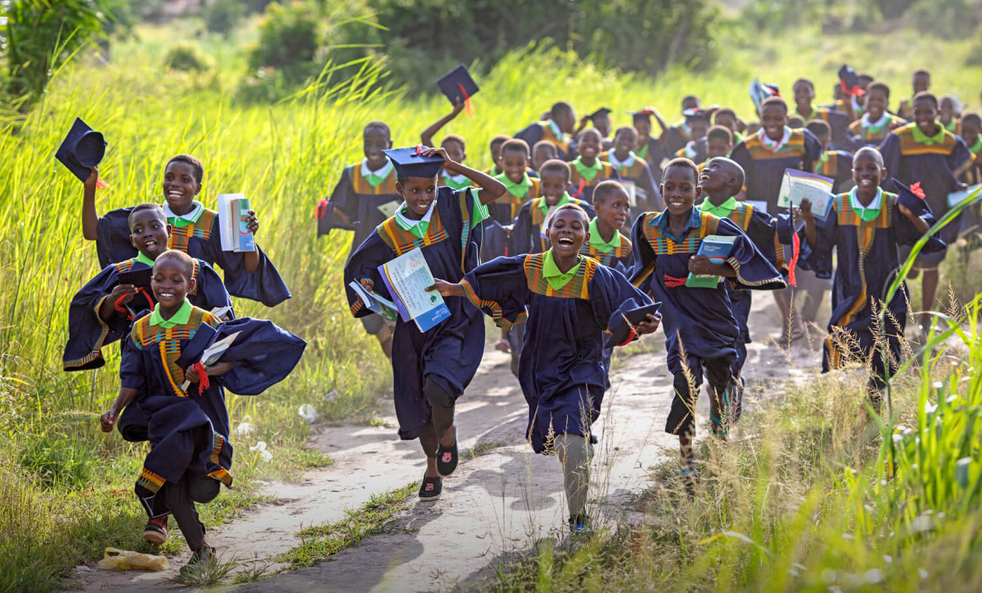 A volunteer and local church leaders prepare stacks of Operation Christmas Child shoebox gifts to share with children in their community.
