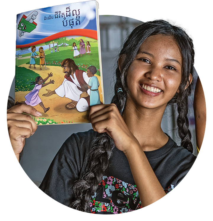 Samnang holding The Greatest Journey