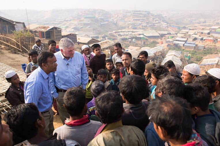 Samaritan's Purse President Franklin Graham speaks with a crowd of Rohingya refugees.
