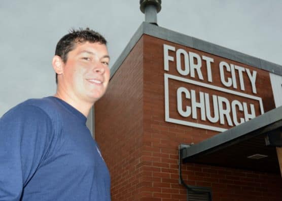 Lucas Welsh in front of Fort City Church