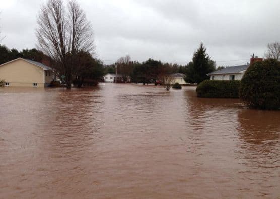 Flood waters around homes in Sussex Corner