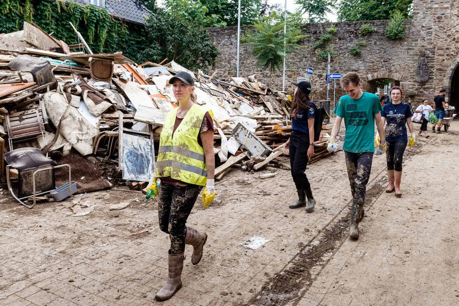 While debris piles up on the streets of Ahrweiler, Christian and Esther Giller (right) and other volunteers are there to share the hope of Jesus Christ.