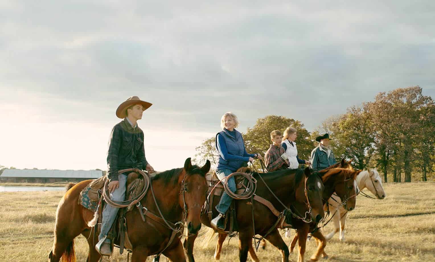 Doris Row with family on her ranch.
