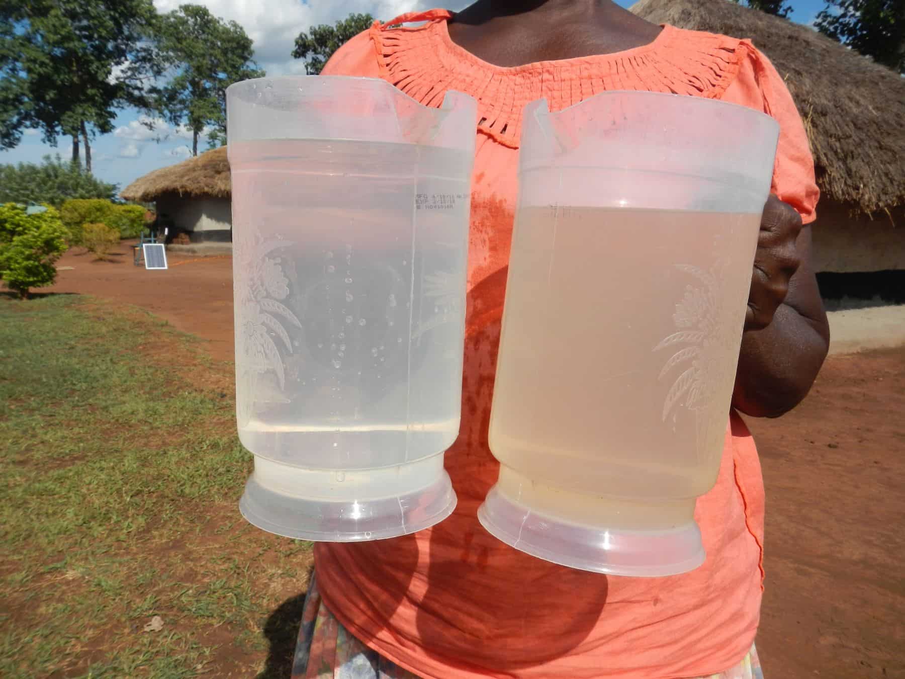 Florence proudly shows unfiltered water on the right, and filtered water on the left.