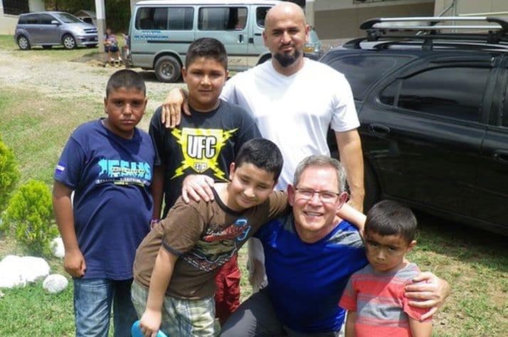 Garry Krushel with a family in El Salvador, working with OCC. (Supplied)