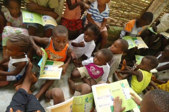 Operation Christian Child recipients in the west African nation of Guinea Bissau crowd together to learn about Jesus during The Greatest Journey classes.