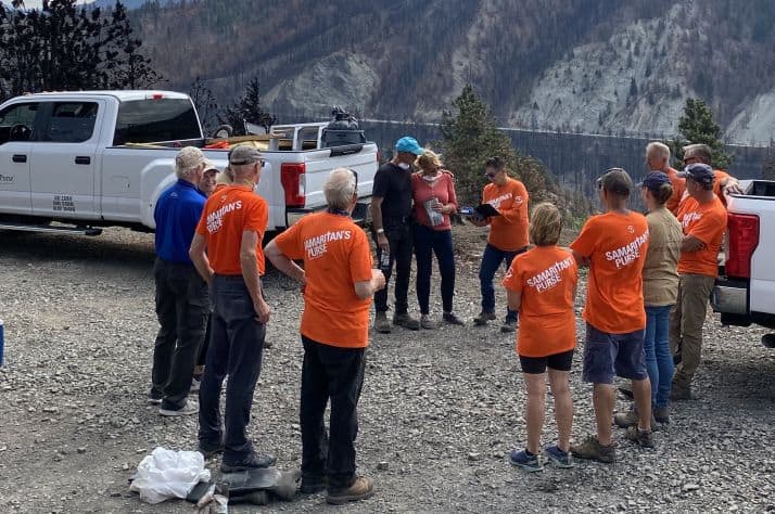 Every homeowner Samaritan’s Purse helps after a disaster is given a Billy Graham Training Center Bible signed by volunteers who worked on their home. Pictured here is the first Bible presentation to homeowners in the surrounding area of Lytton, British Columbia.