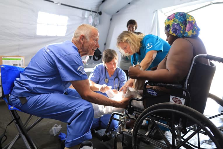 Hurricane survivors, including Lucinda Haven, are being treated at our Emergency Field Hospital.