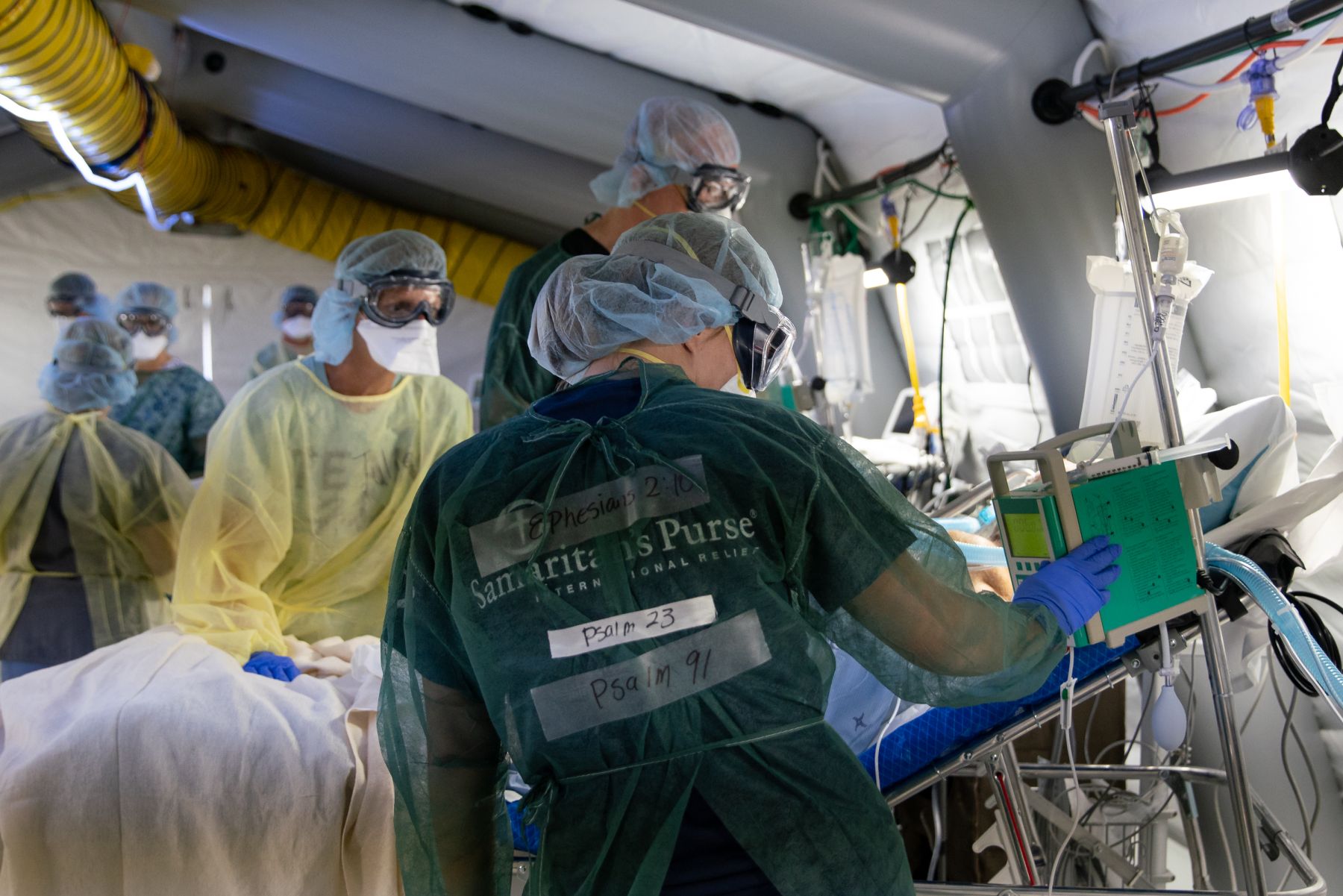 Shannon, an ICU nurse, has Bible verses written on tape securing her PPE. “I pray that patients see Jesus in us,” she said. "I have the hope of Jesus and...ultimately He’s in control of all; that is the hope that carries me through.”