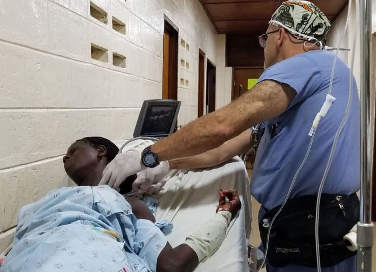 Iyad works with a cancer patient.