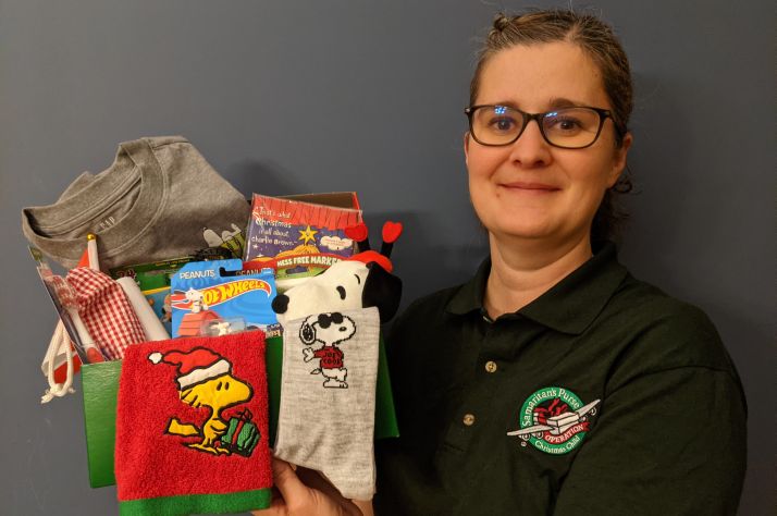 A mother in Alberta packs Operation Christmas Child shoeboxes for children in need as a tangible expression of God’s love.