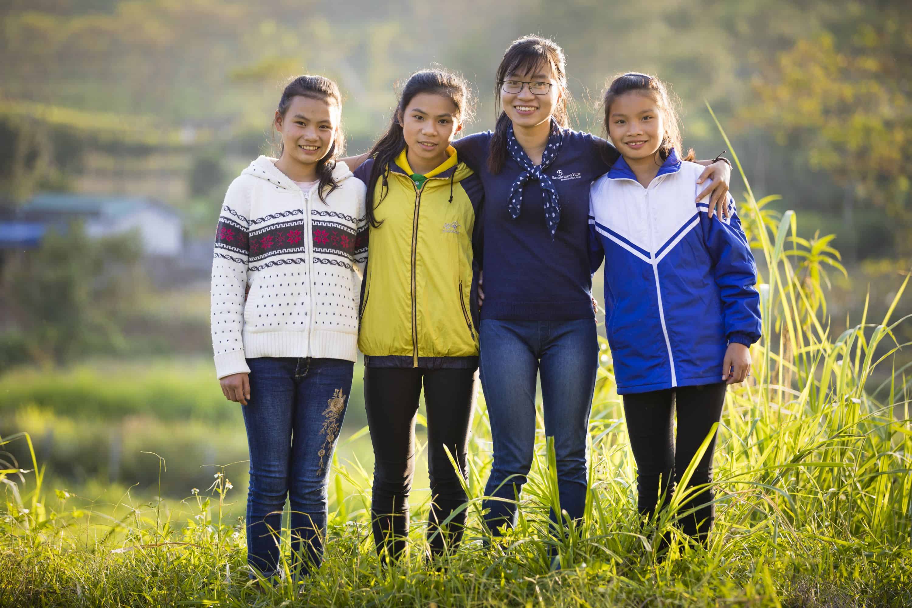 Tan, left, has lived at the orphanage for three years.