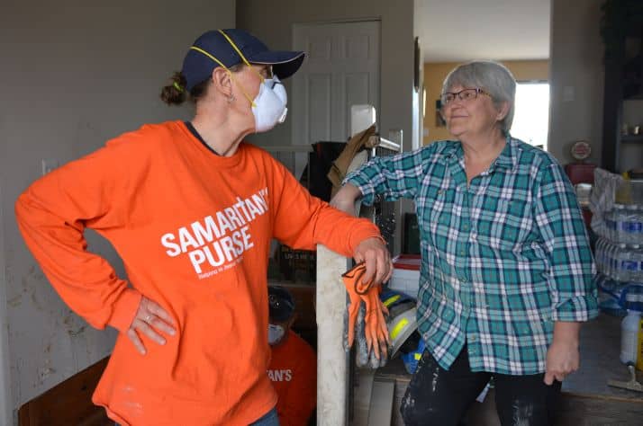 Samaritan's Purse volunteer Linda Mywaart encourages Fort McMurray homeowner Sheila Sutton.